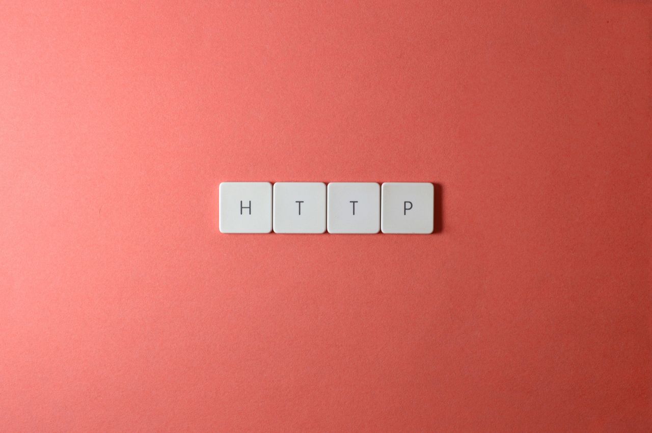 gallery-3 HTTP spelled with keyboard keys on a pink background, minimalist style.
