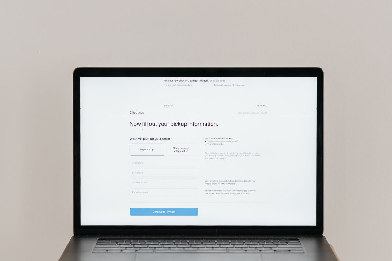 about-img A laptop displaying an online checkout form, highlighting technology and e-commerce.